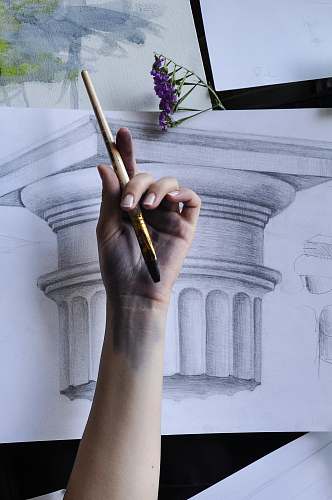finger person holding paint brush architecture