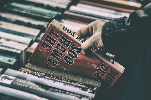 book person holding The Human Zoo book book store