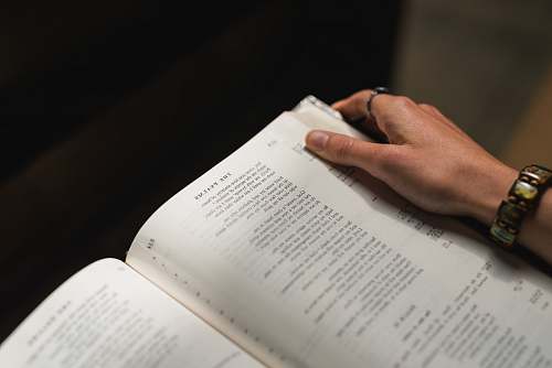 bible person holding white book text