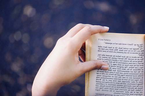 book person turning book page reading