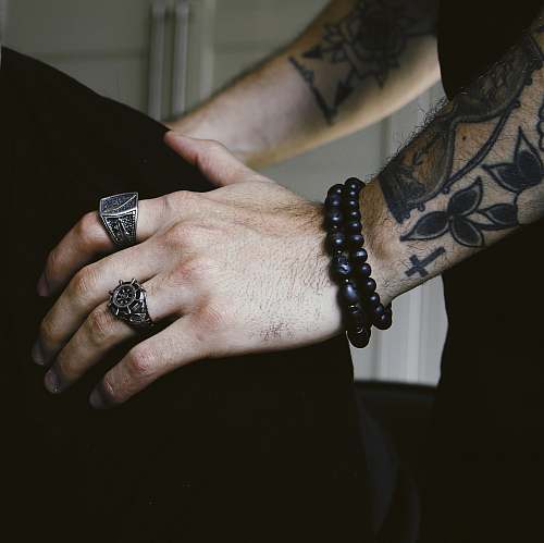 human person wearing black bracelet person