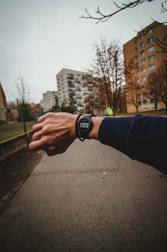 wristwatch person wearing black smartwatch person