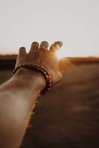 illinois person wearing brown beaded bracelet united states