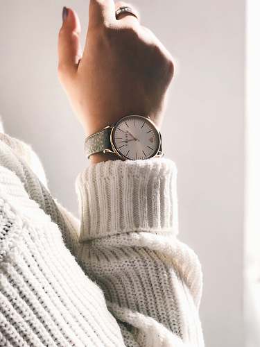 wrist person wearing round silver-colored analog watch watch