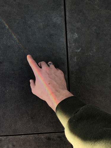 human person wearing silver-colored ring arm