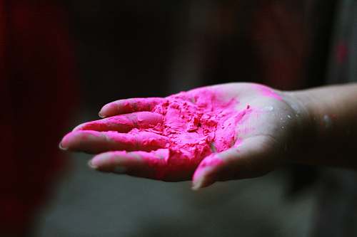 finger pink powder in right human palm pink