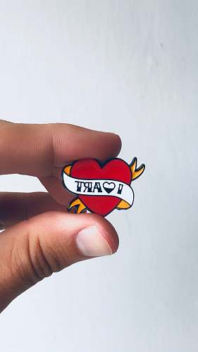 human red heart pin person