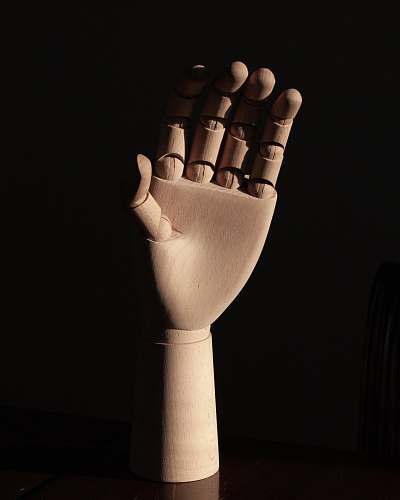 finger right human dummy hand on brown surface brown