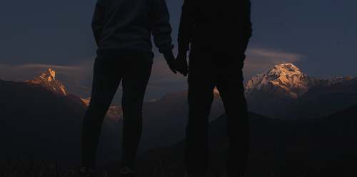 person silhouette photo of two people holding hands holding hands