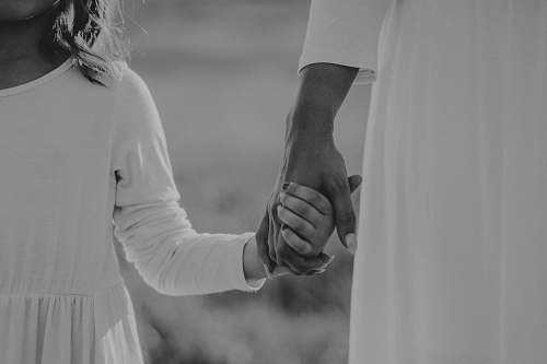 black-and-white two person holding hands photography grey