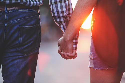 human two person standing and holding hands together holding hands