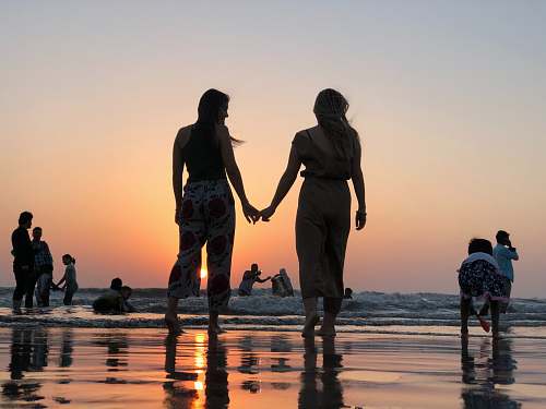 human two women holding hands person
