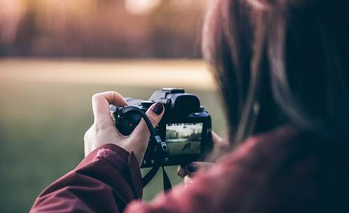 mississauga woman holding black DSLR camera photographer