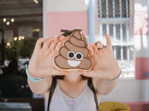 human woman holding poop case person