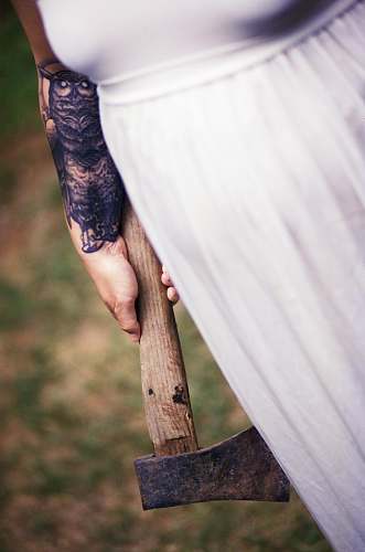 axe woman wearing white shirt holding axe hatchet