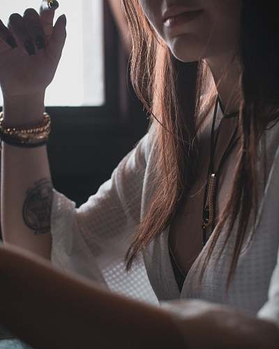 person woman wearing white V-neck 3/4-sleeved blouse human