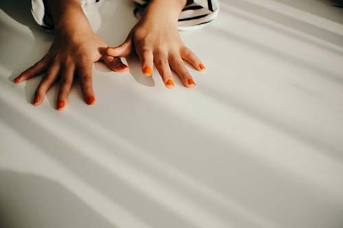 person woman with orange manicure human
