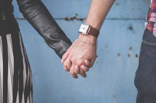 couple man and woman holding hands love