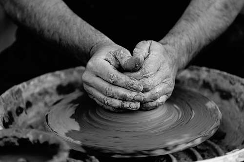 black-and-white person making pot grey