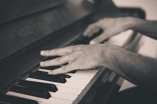 hand person playing piano music
