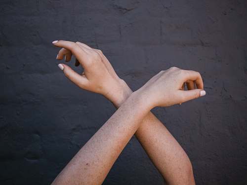 person crossed person's arms hand