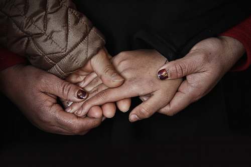 person four hands holding people