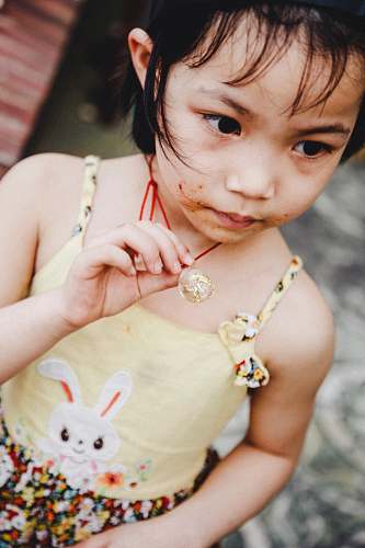 person girl holding necklace people