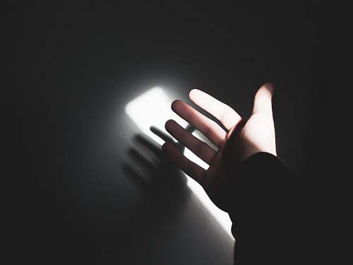person left human palm lighting