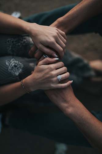 person man and woman holding each others hands people