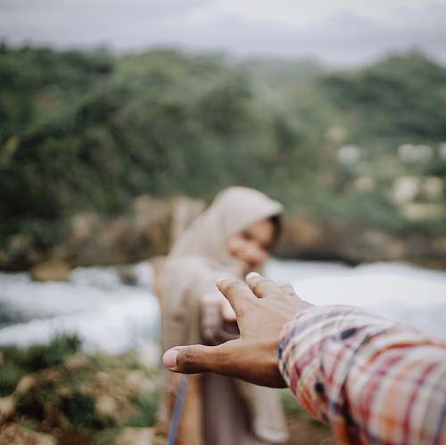hand man and woman reaching hands finger