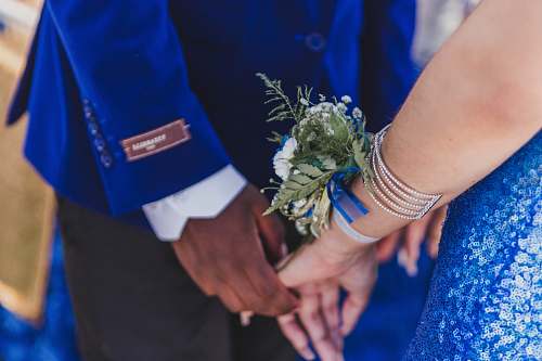 person man and woman standing and holding hands hand