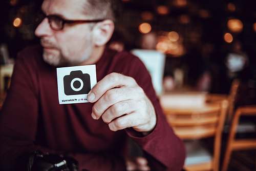 person man walking a card with camera icon sticker