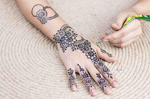 person mehndi tattoo skin