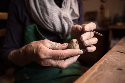 person person holding bird wood craft people