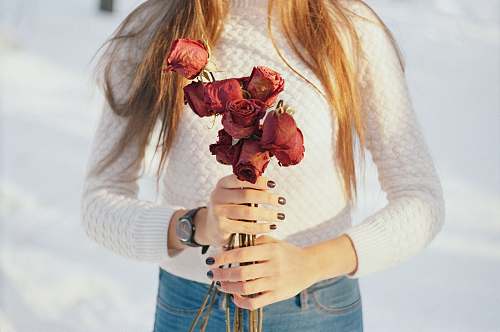 flower person holding bouquet of red roses rose