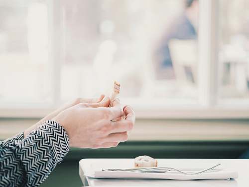 person person holding food hand