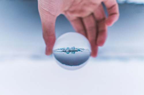 person person holding glass ball iceland