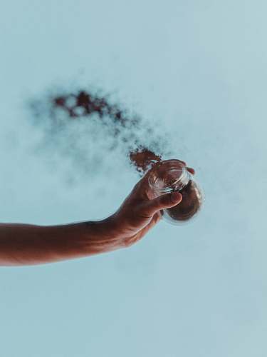 person person holding jar with powder hand