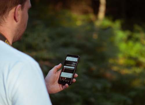 person person holding smartphone people