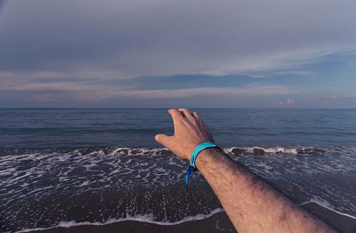 person person reaching out arm