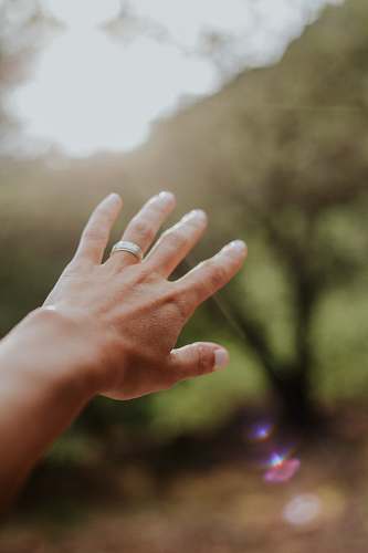 person person right hand wearing silver band ring finger