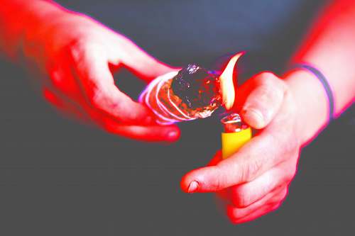 hand person using disposable lighter flame
