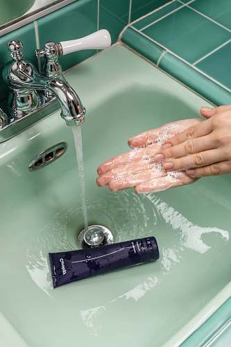 person person washing hands on sink skin