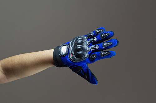 person person wearing blue and black gloves apparel