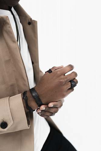 hand person wearing brown jacket finger