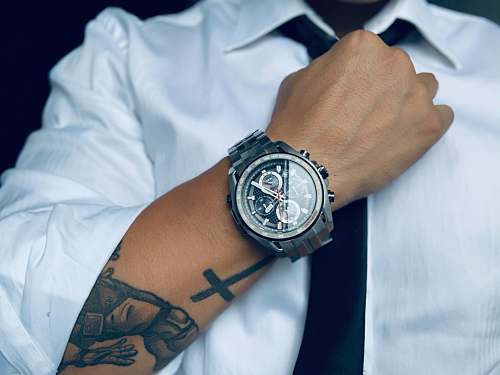 person person wearing gray analog and digital watch wristwatch