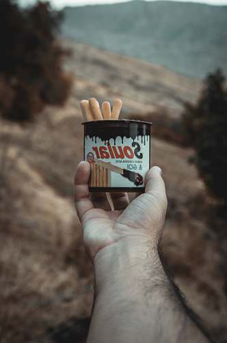 finger Soular breadsticks in can hand