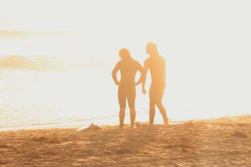 person two persons on seashore hand
