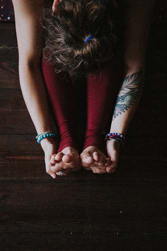 skin unknown person stretching indoors tattoo