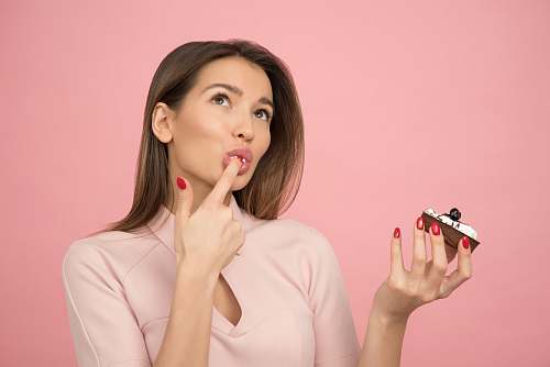 person woman holding cake looking up people